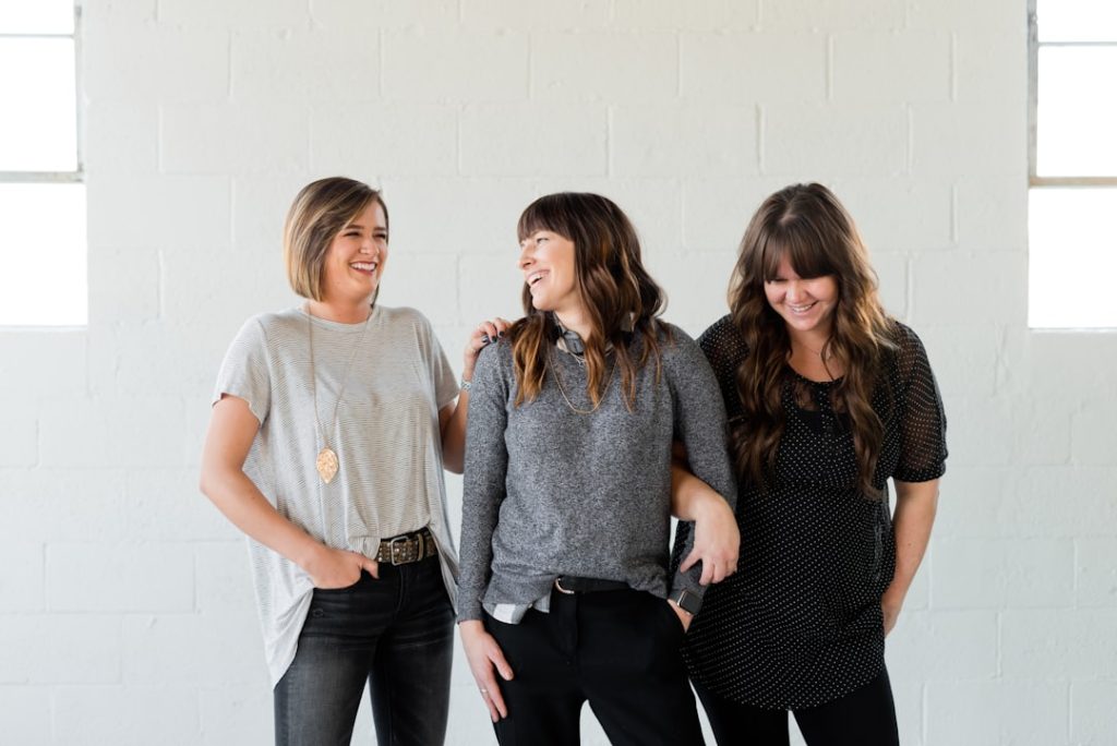 Work colleagues share a laugh about the stresses of their work in Logan, Utah. Kulor Salon in Logan Utah is the best option for a luxury salon experience.